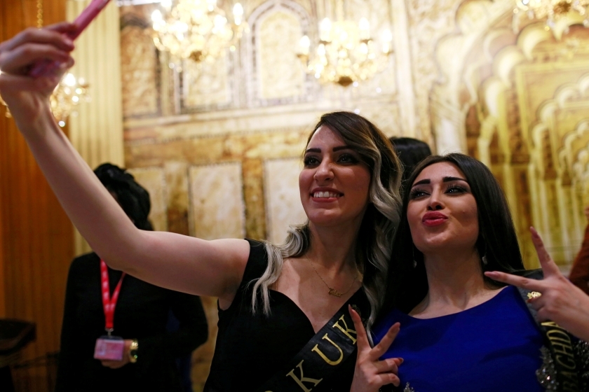 Participants take a selfie during the Miss Iraq Pageant in Baghdad, Iraq, May 25, 2017. (Photo: Reuters)